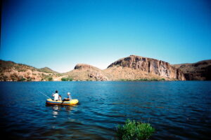 boys in boat in arizona